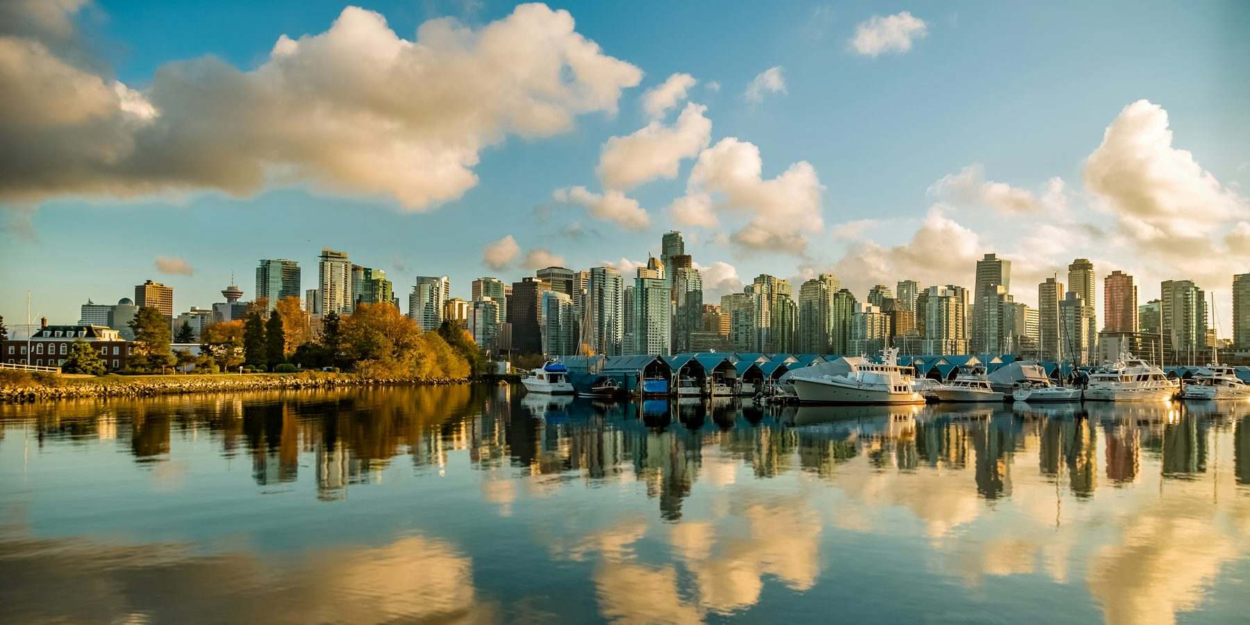 Vancouver's downtown skyline and Coal Harbour marina in golden afternoon light