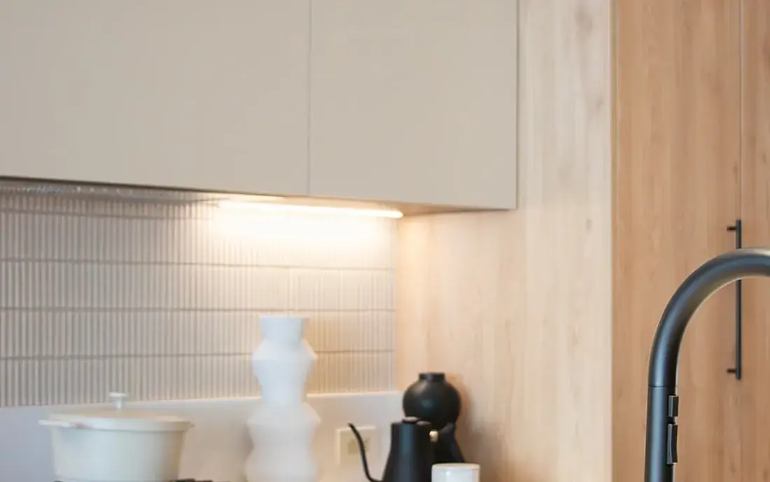 Refined interior at WREN Upper Westside with light wood cabinetry