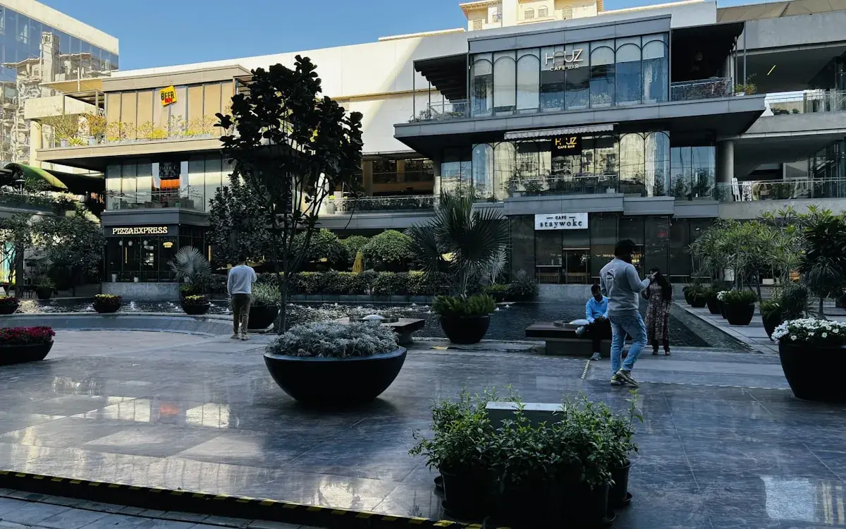Modern open-air retail plaza with contemporary glass architecture