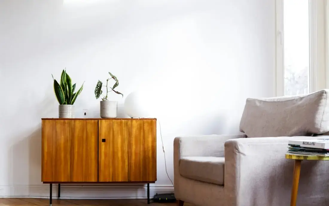 Bright minimalist living room with a wooden sideboard in a Lower Lonsdale rental