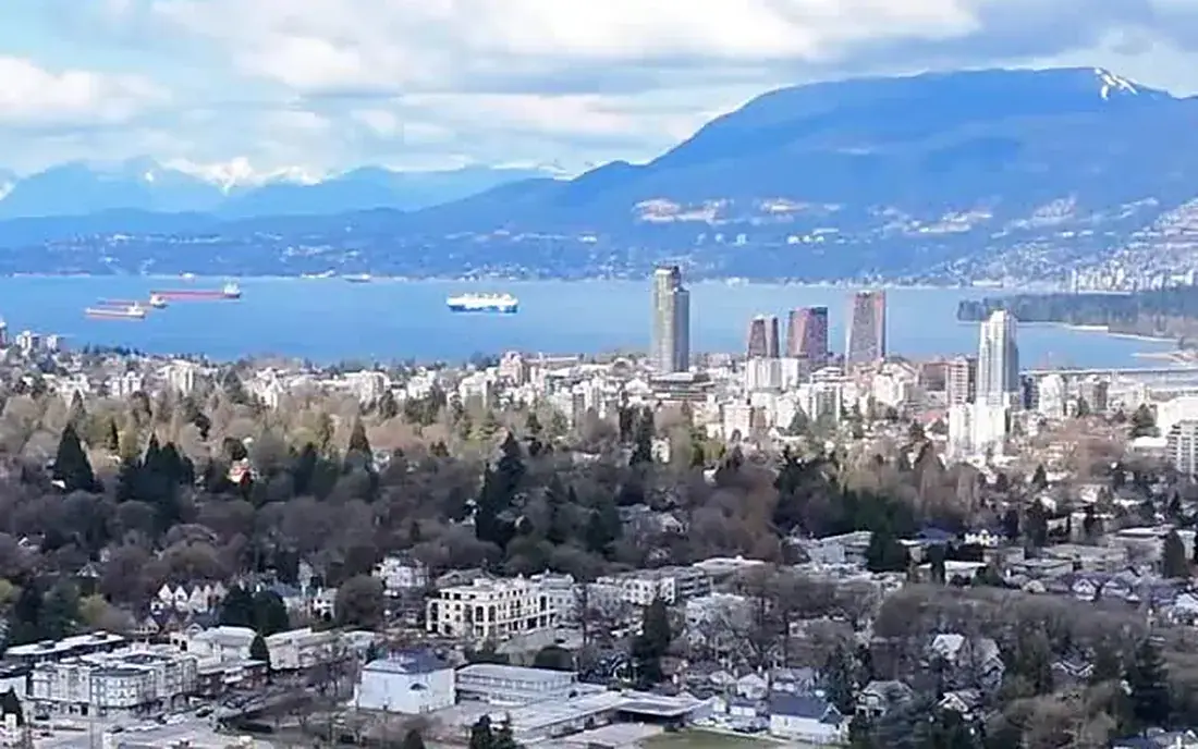 Drone view of WREN Upper Westside under construction with English Bay beyond